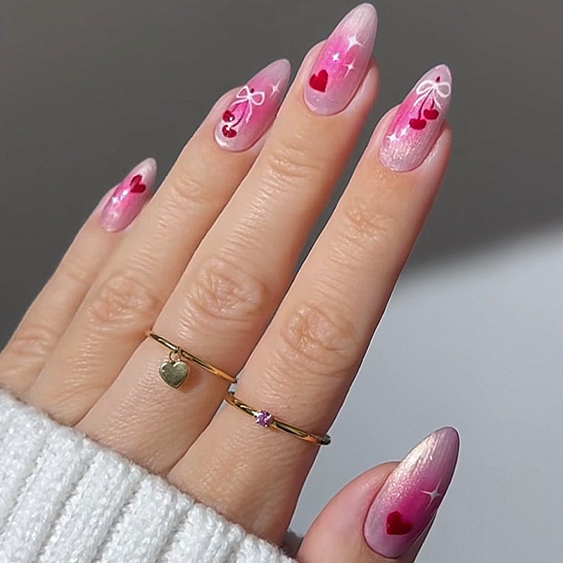 Charmante Acryl Press-On Nägel Set mit Herz- und Schleifenmotiven Karnz