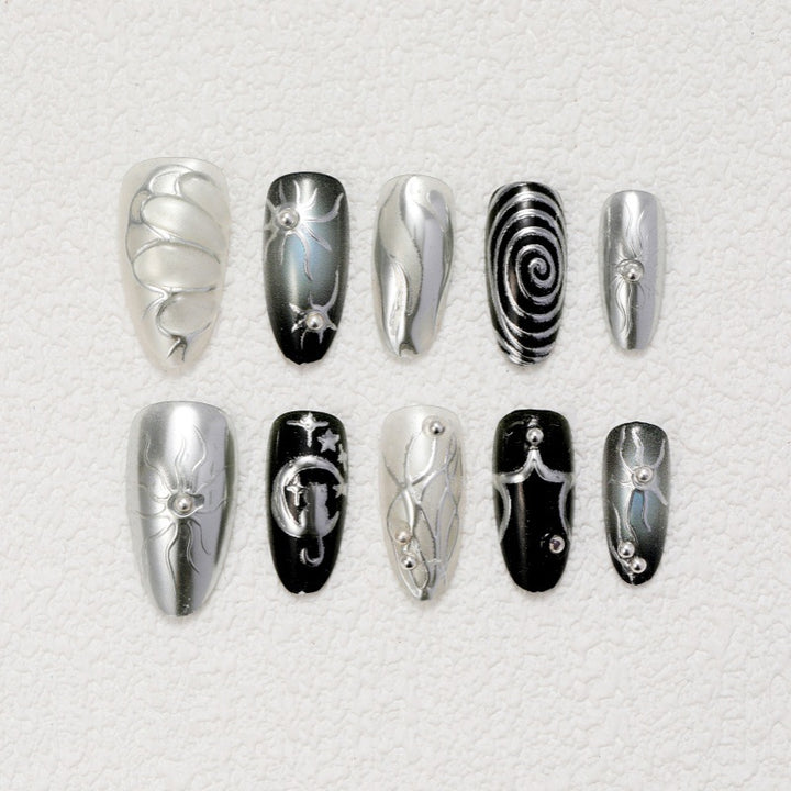 Kunstnägel mit Metallic-Effekten und komplexen Designs Karnz