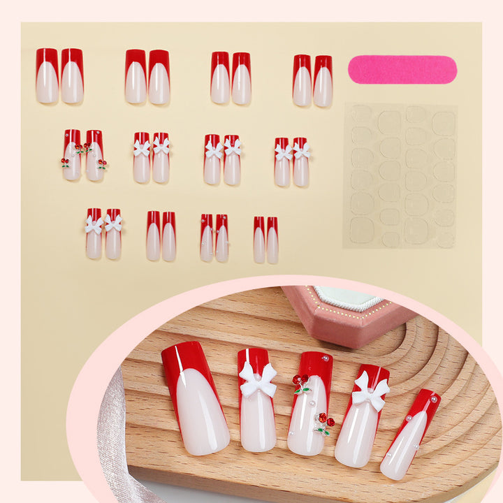 Kreatives Nagelset mit festlichen Kirschmotiven Karnz