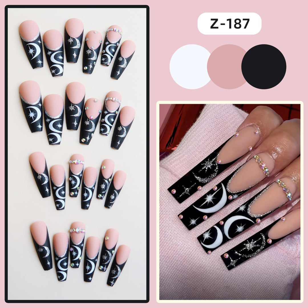Künstlerisches langes Stiletto Press-On Nagelset mit Mond- und Sternmustern