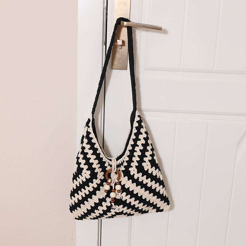 Damen Handtasche mit kunstvollem Flechtmuster Karnz