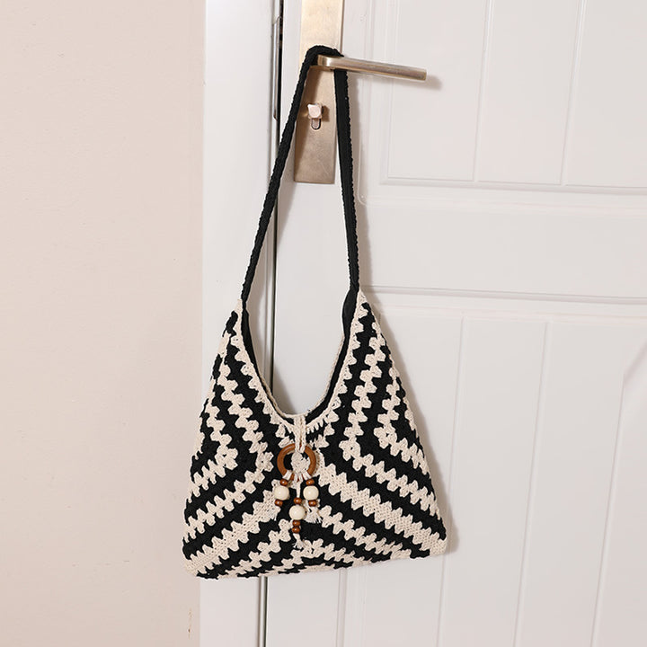 Damen Handtasche mit kunstvollem Flechtmuster Karnz