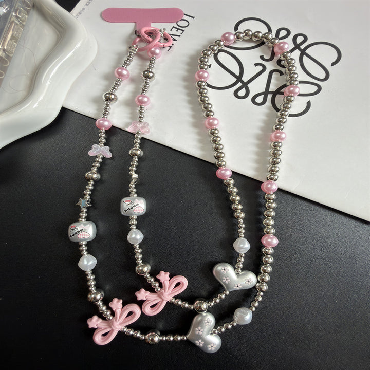 Mehrsträngige Perlenkette mit Charms Karnz