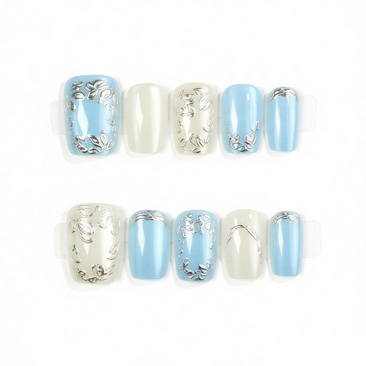 Dekoratives Press-On Nail Art Set mit floralen und metallischen Akzenten Karnz