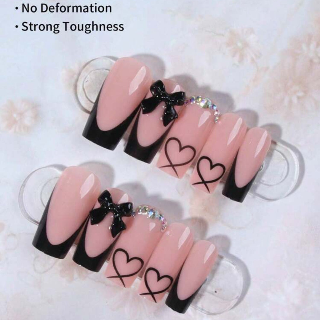 Kunstnagelset mit elegantem Herz- und Schleifenmotiv Karnz