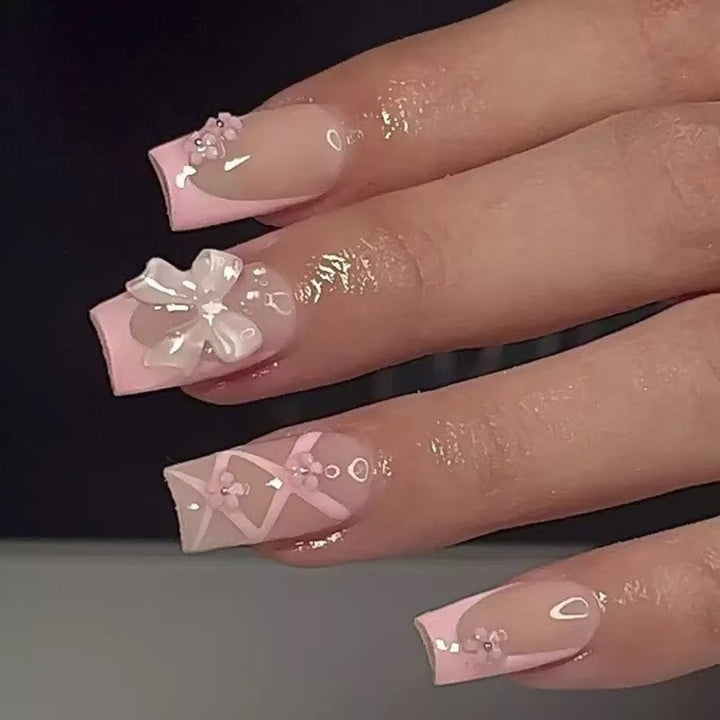 Kunstnagelset mit filigranen 3D-Blüten und Schleifen Karnz
