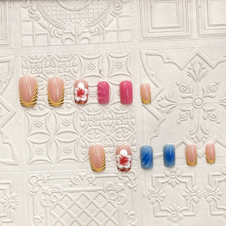 Künstlerisches Press-On-Nagelset mit floralen und Wellenmotiven Karnz