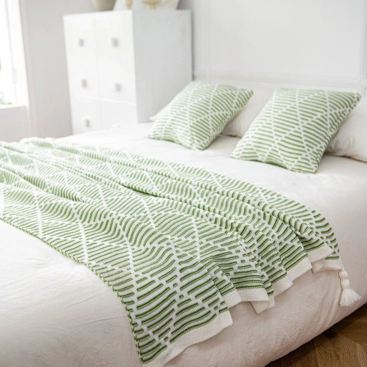 Dekorativer Strickwurfdecke