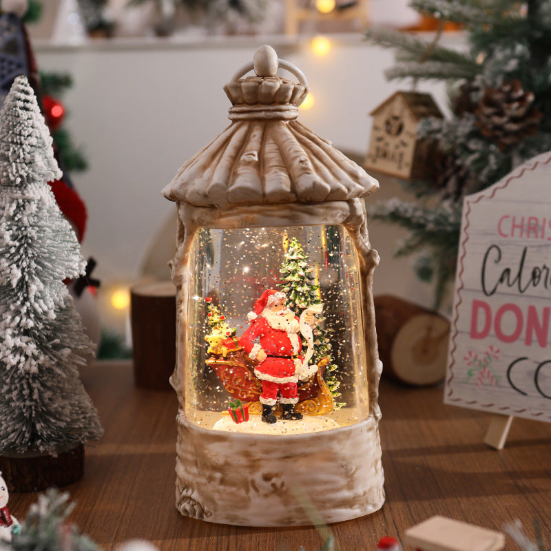 Beleuchtete Weihnachtslaterne mit Schneeszenen Karnz