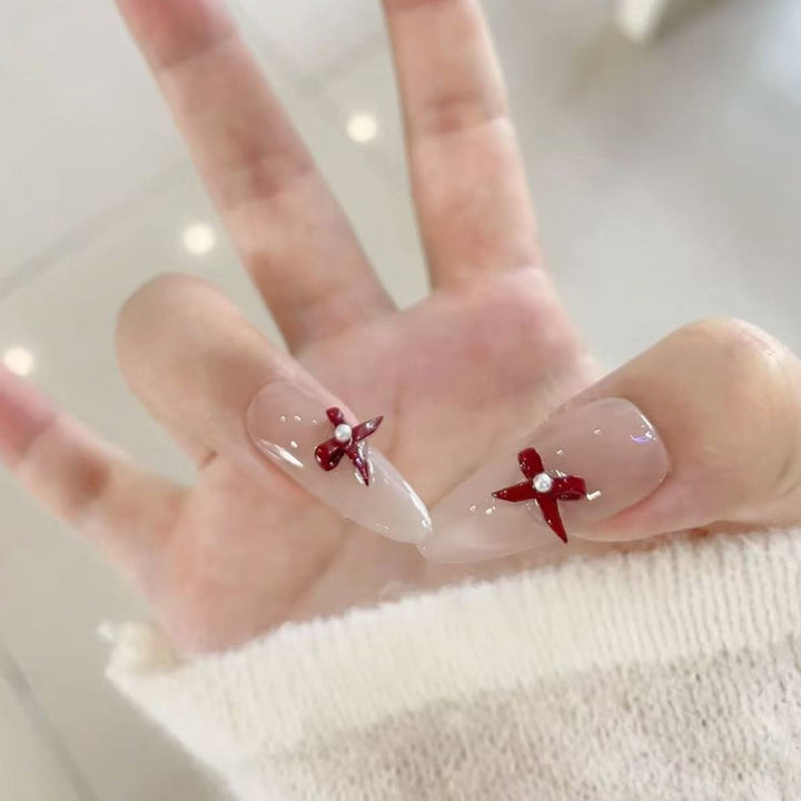 Elegante Stiletto Press-On Nägel mit dekorativen Akzenten Karnz