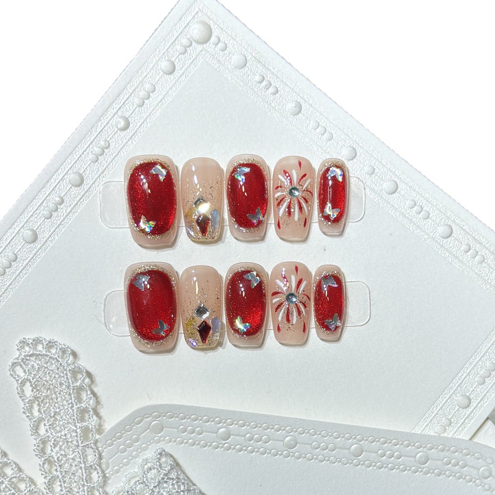 Künstlerisches Press-On Nail Set mit Glitzer und Sternelementen Karnz