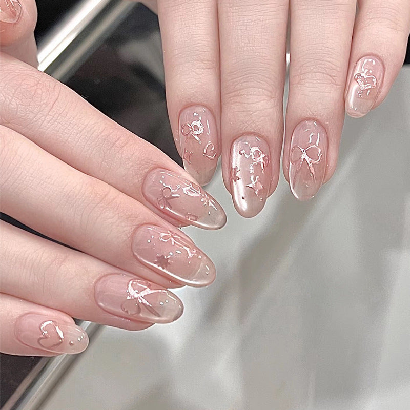 Elegante künstlerische Press-On-Nagelkunst mit Schleifen- und Herzdesigns Karnz