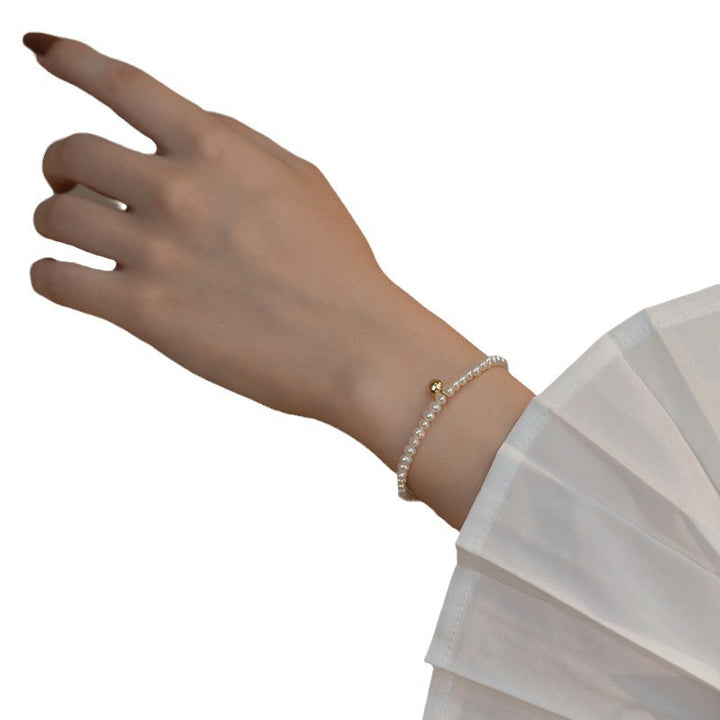 Perlenarmband mit Feinem Goldakzent Karnz