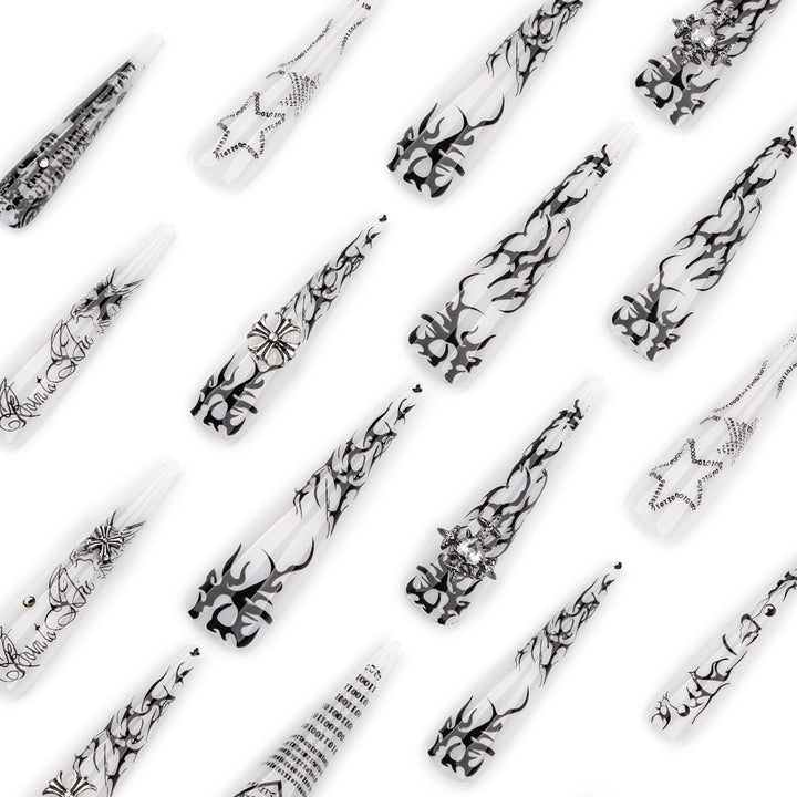Kunstvolle Stiletto-Nägel mit Gothic-Muster und Verzierungen Karnz