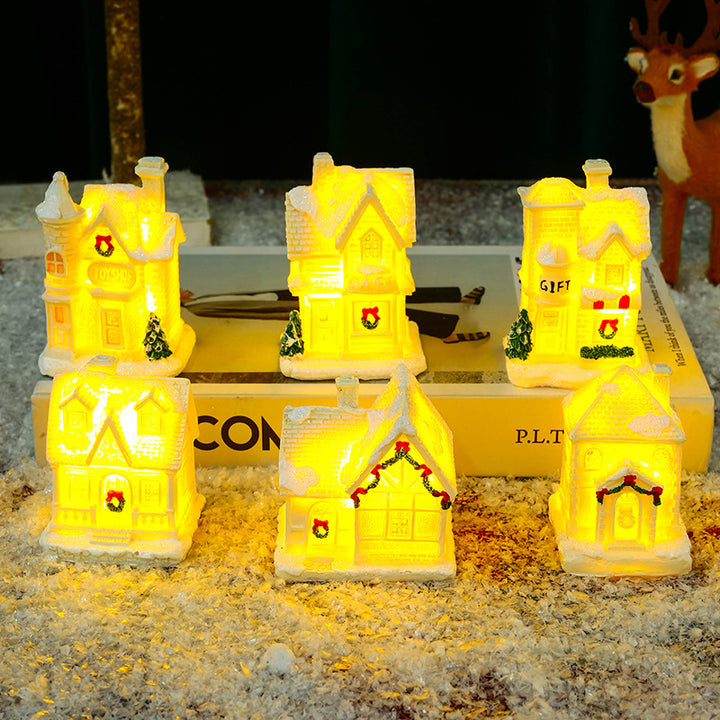 Beleuchtetes Weihnachtsdorfhaus mit festlicher Dekoration Karnz