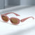 Damen modische Sonnenbrille mit stilvollem, geschwungenem Rahmen Karnz