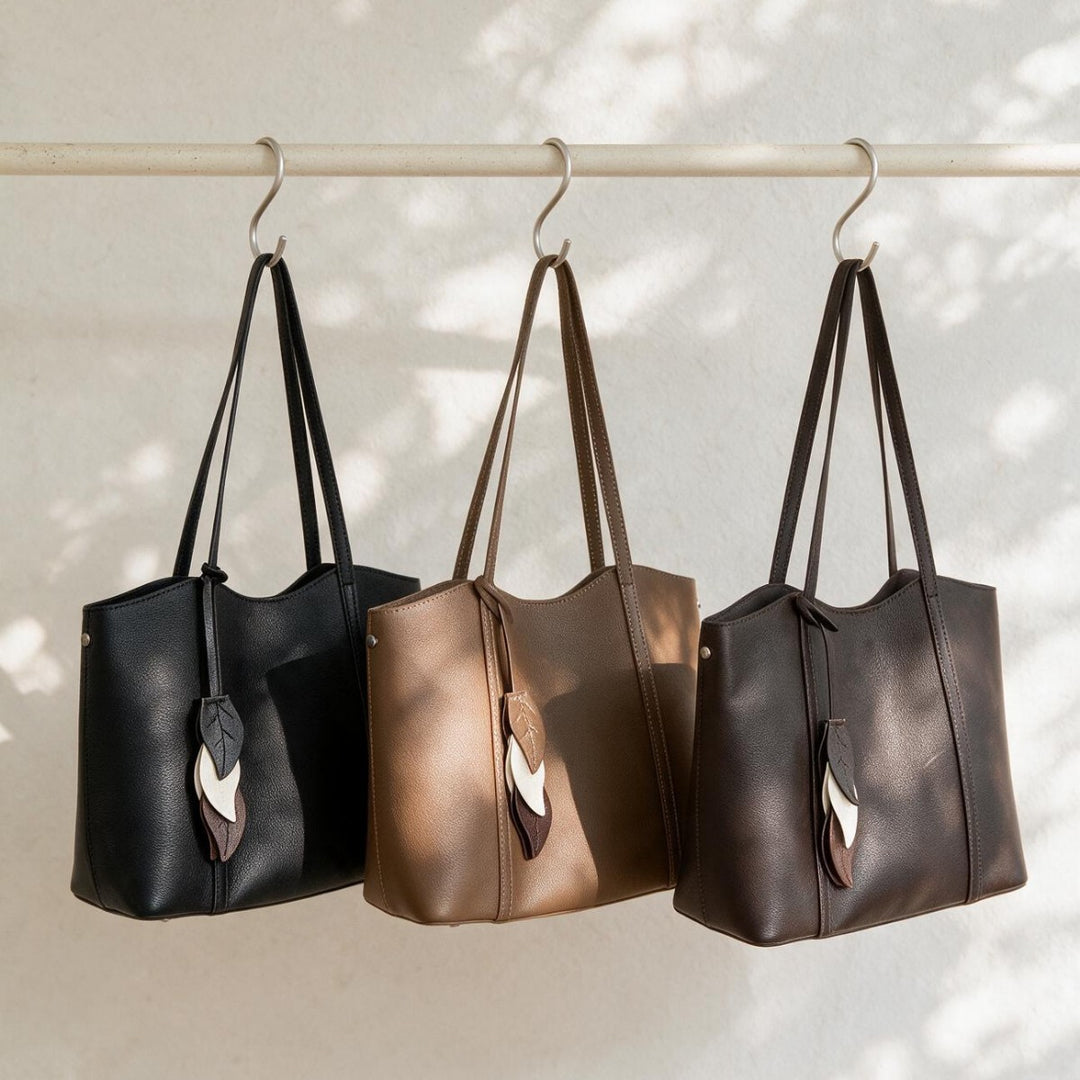 Gepunktetes vegan-leder strukturiertes Tote mit Blattcharm & langen Schulterträgern