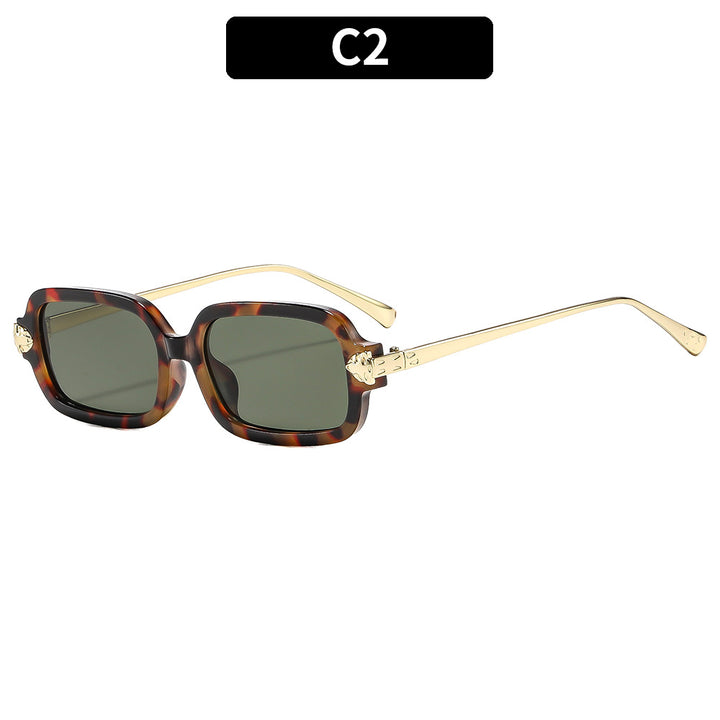 Hochwertige winkelige Sonnenbrille mit goldenen Akzenten