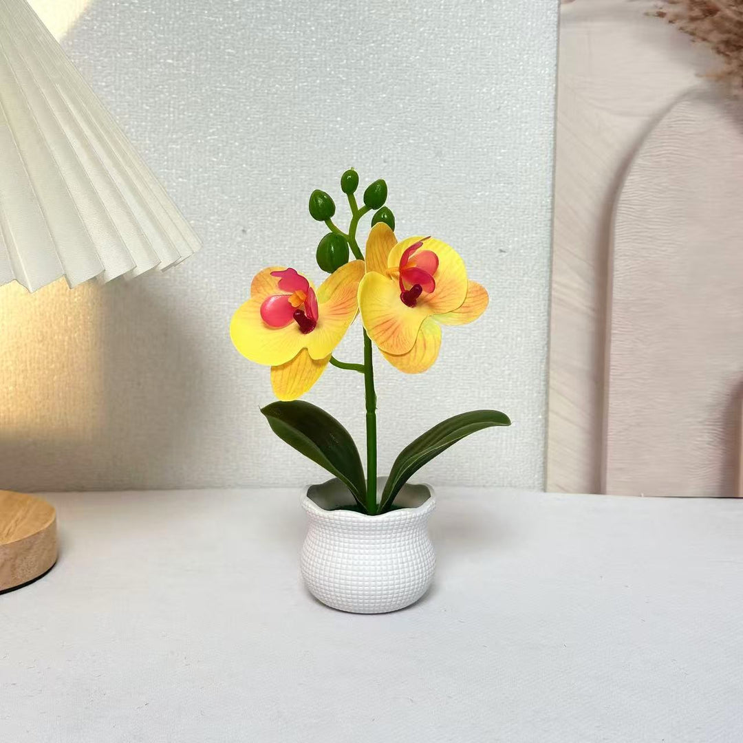 Elegante künstliche Orchideenpflanzenanordnung für die Wohnkultur-Darstellung