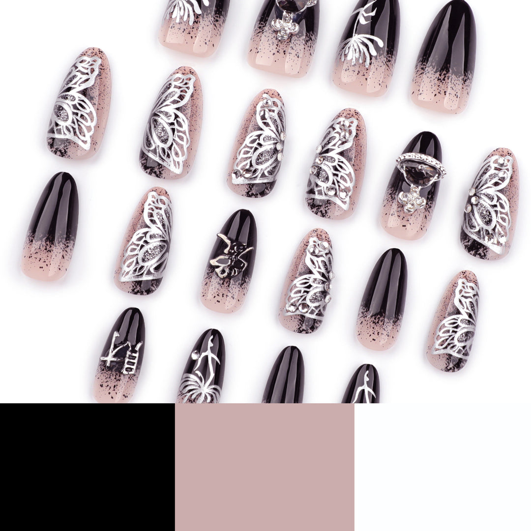 Kunstvolle Stiletto-Nägel mit filigranen Verzierungen und Glamour-Akzenten Karnz
