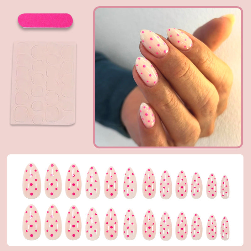 Kunstnagelset mit verspielten Punkten und elegantem Design Karnz