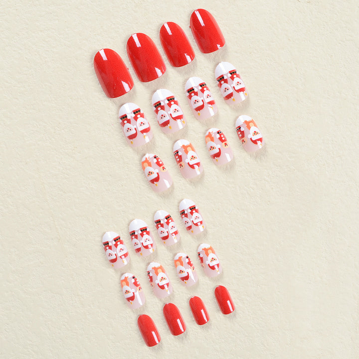 Kunstnagelset im festlichen Weihnachtsdesign mit niedlichen Motiven Karnz