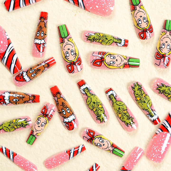 Kunstnagelset mit festlichen Motiven und charmantem Grinch Design Karnz