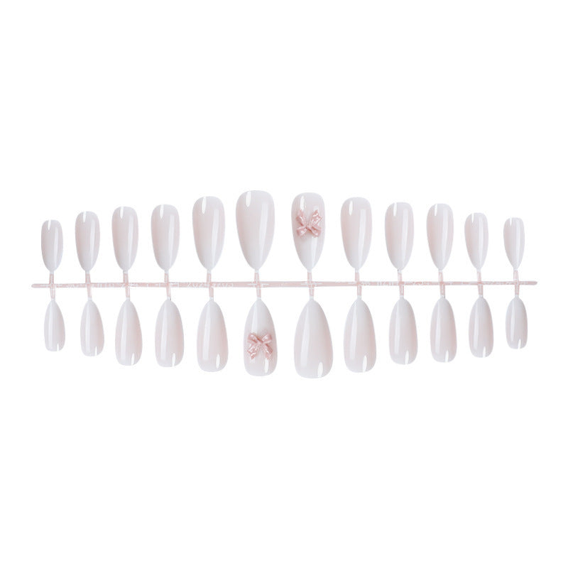 Elegantes Kunstnagelset mit luxuriösem Ombre-Effekt und zarten Schleifenakzenten Karnz