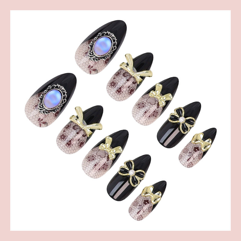 Kunstnagelset mit eleganten Punkt- und Schleifenverzierungen Karnz