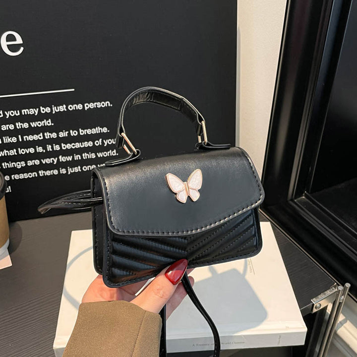 Schmetterlings-verzierte Handtasche