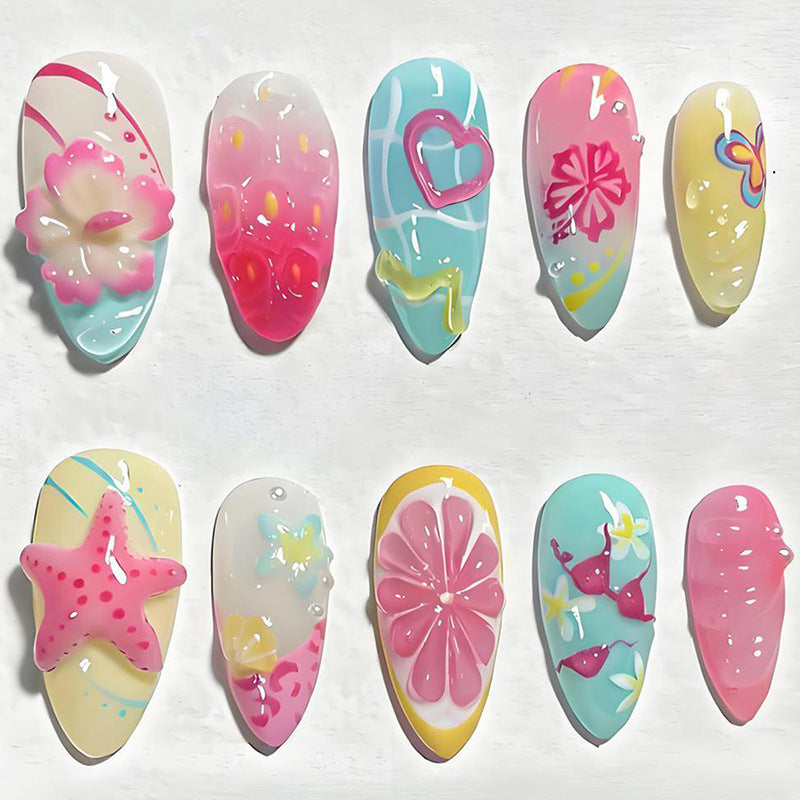 Kunstnagelset mit floralen und fröhlichen Motiven Karnz
