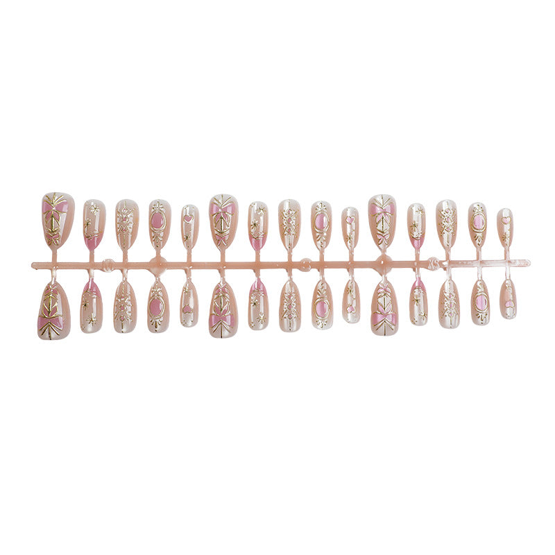 Dekoratives Press-On Nagelkunst-Set mit floralen und metallischen Akzenten