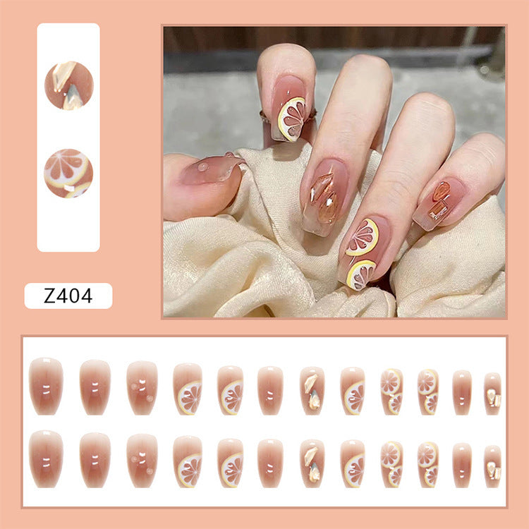 Kunstnagelset mit fröhlichen Zitrusmotiven und eleganten Designs Karnz