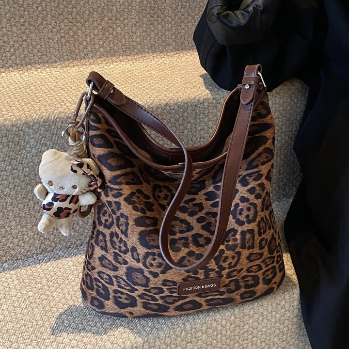 Stylische reversible Schultertasche