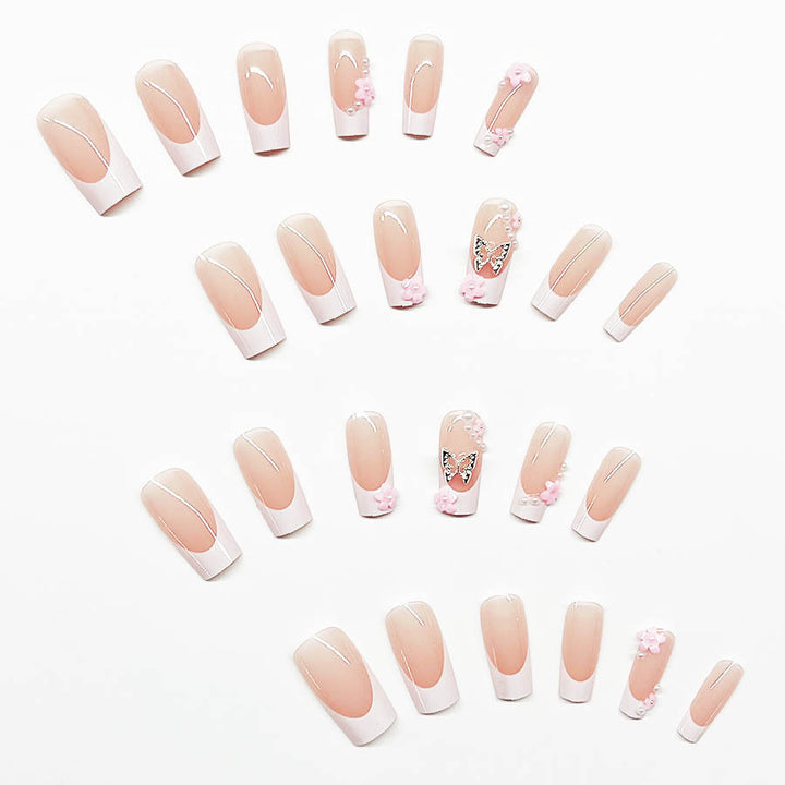 Kunstnagelset mit verspielten 3D-Blüten und Glitzerakzenten Karnz