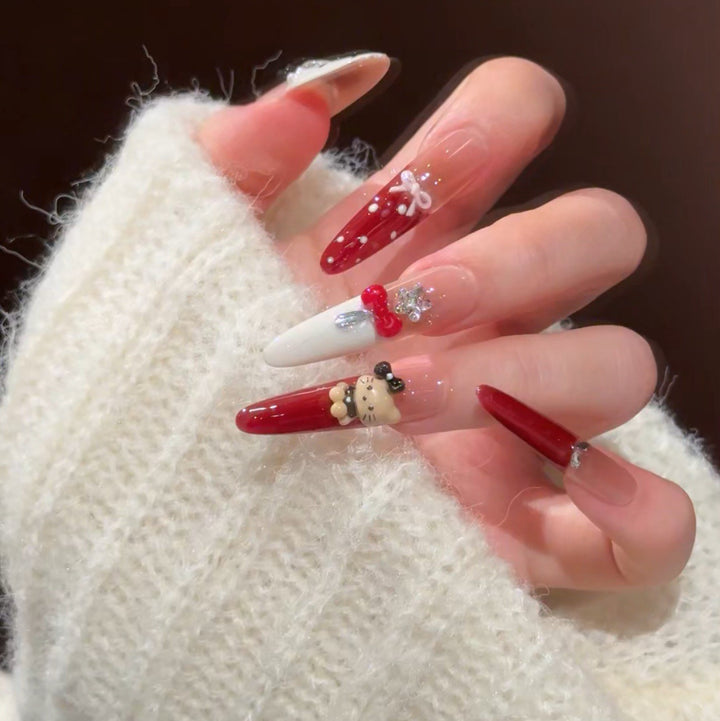 Künstlerische Stiletto Press-On Nagelkunst mit schimmernden Akzenten Karnz