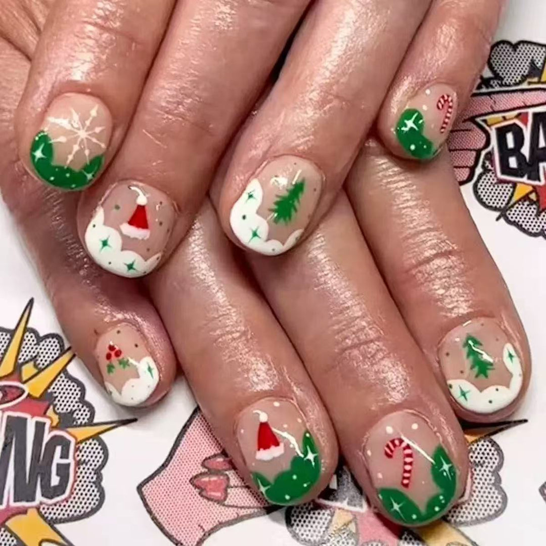 Kunstnagelset mit weihnachtlichen Motiven und Glitzerakzenten Karnz
