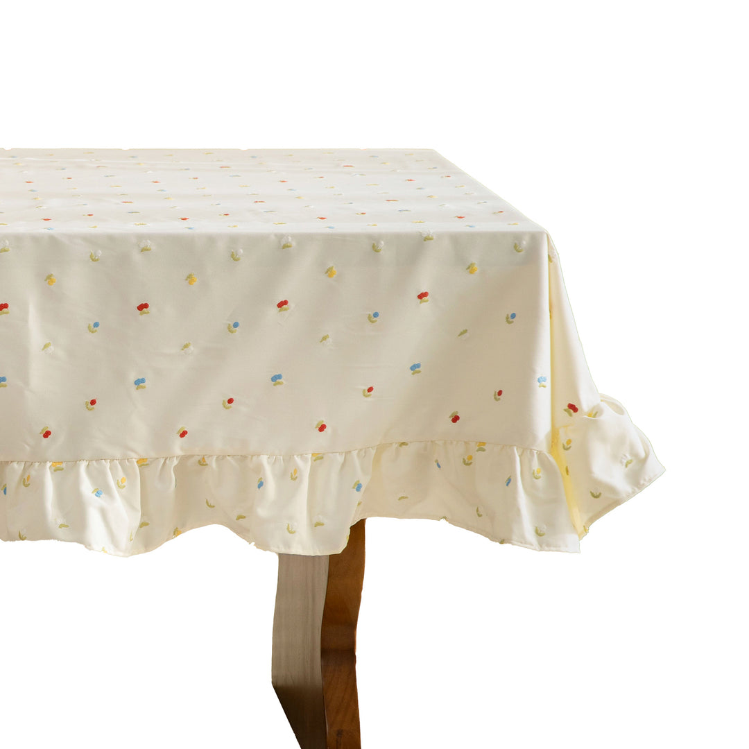 Tischdecke mit besticktem Mini‑Blütenmuster und Volantkante Karnz