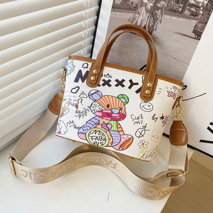 Verspielte illustrierte Schultertasche