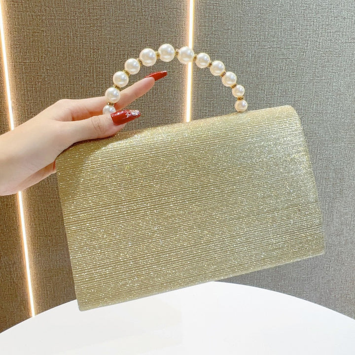 Elegante Abendtasche mit Perlengriff