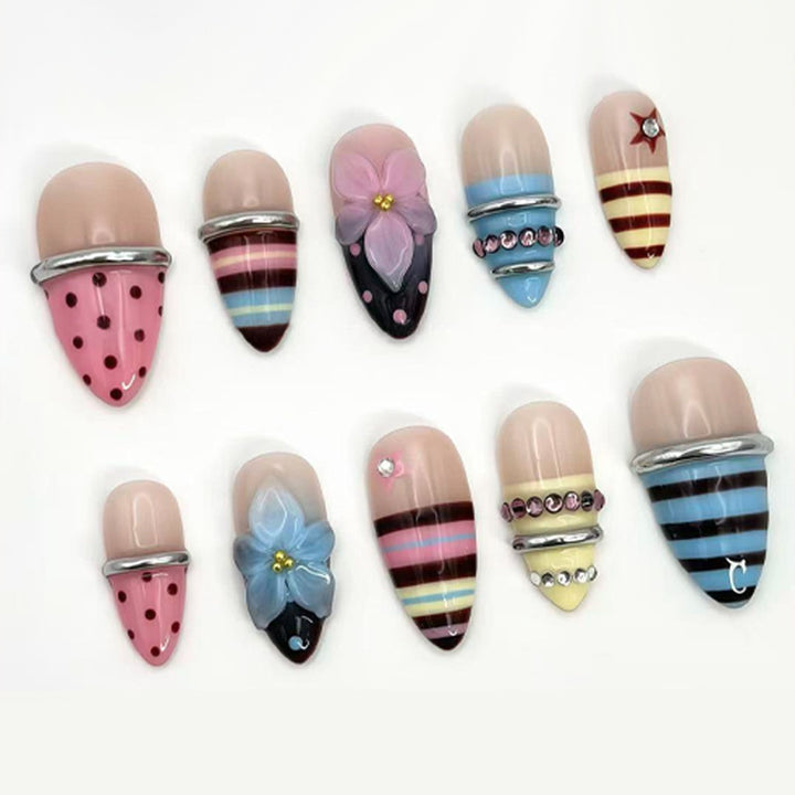 Kunstnagelset mit kreativen und verspielten Motiven Karnz