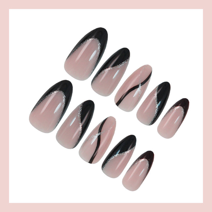 Kunstnagelset mit elegantem Schwarzweiß-Design und Glitzerakzenten Karnz