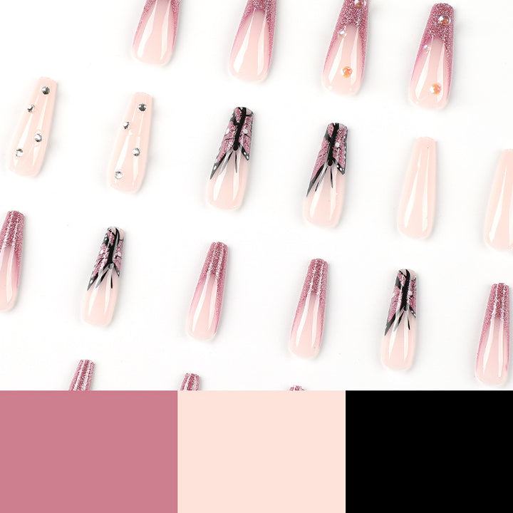 Kunstvolle Stiletto-Nägel mit floralen und glitzernden Akzenten Karnz