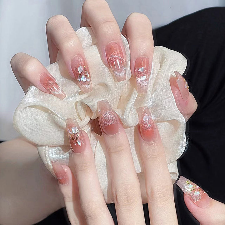 Kunstnagelset mit eleganten Glitzer- und Blumendekoren Karnz