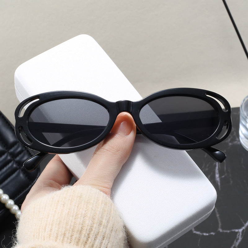Damen modische Sonnenbrille mit ovalem Rahmen und einzigartigem Design Karnz