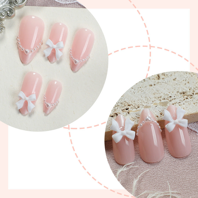 Dekoratives Press-On Nagelkunstset mit elegantem Bogen und Perlenakzenten Karnz