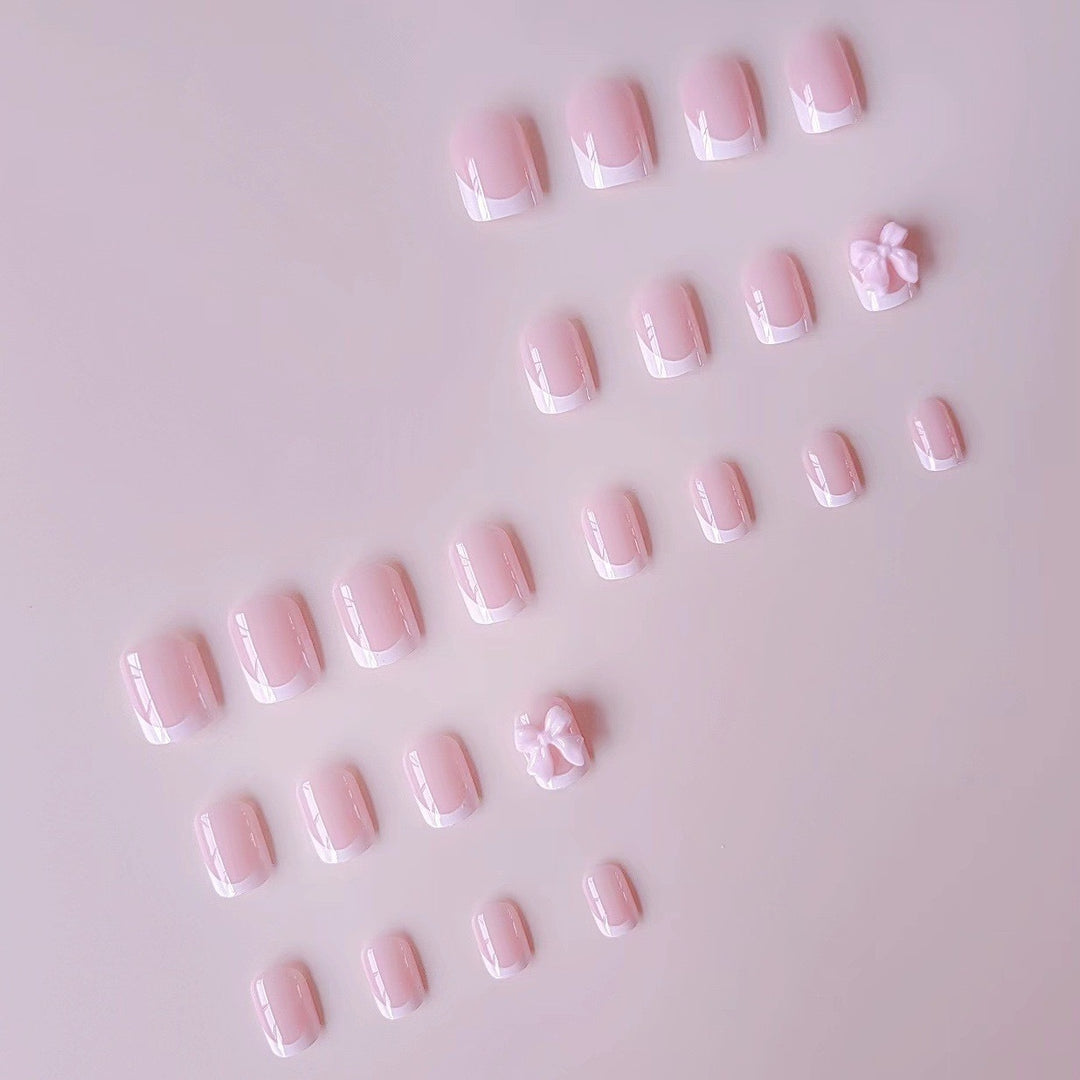 Kunstnagelset mit eleganten Spitzen und 3D Schleifenverzierungen Karnz