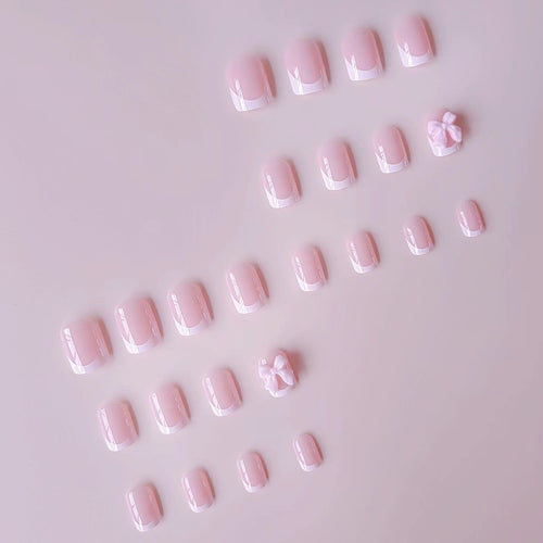 Kunstnagelset mit eleganten Spitzen und 3D Schleifenverzierungen Karnz
