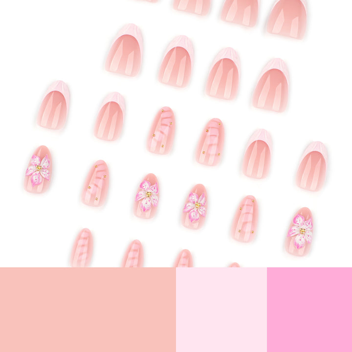Kunstvolle Nagelverlängerungen mit floralem Design und Glitzerakzenten Karnz