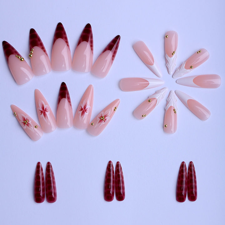 Kunstfingernägel Im Eleganten Modernen Stiletto-Stil mit Floralem Design und Goldenen Akzenten Karnz